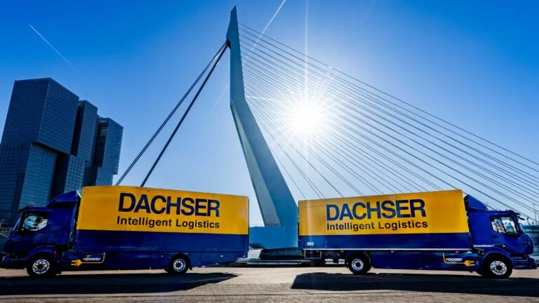 DACHSER etrucks in front of the Erasmus bridge in Rotterdam